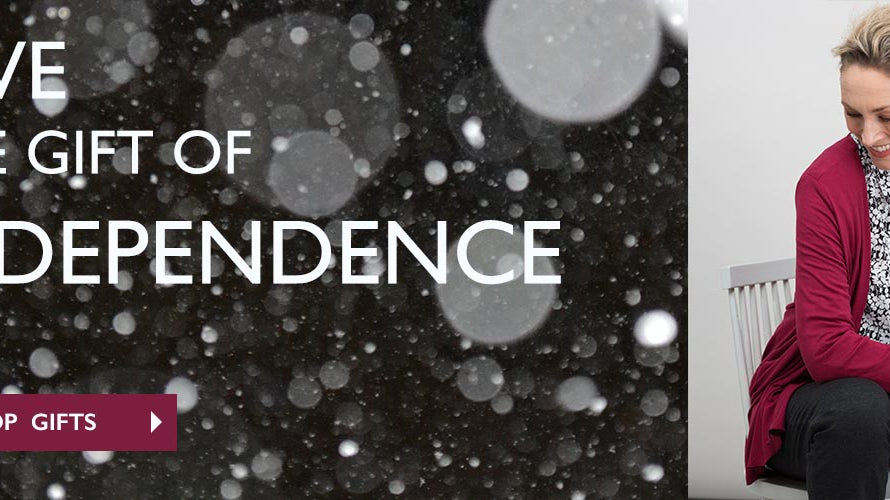 Give the gift of independence banner with lady wearing monochrome print shirt and red cardi