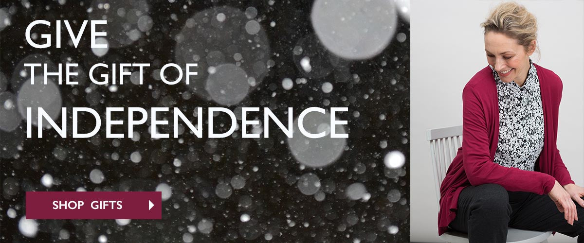Give the gift of independence banner with lady wearing monochrome print shirt and red cardi