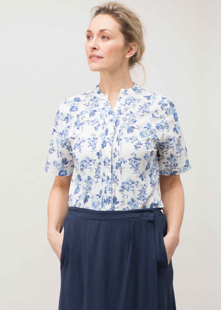 Plus size shirt with short sleeves and all over blue floral print