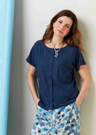 Tabatha Navy Cotton Short Sleeve Velcro Tee paired with Seaspray petal necklace - The Able Label