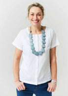 Tabatha White Cotton Short Sleeve Velcro Tee paired with a botanic seaspray necklace- The Able Label